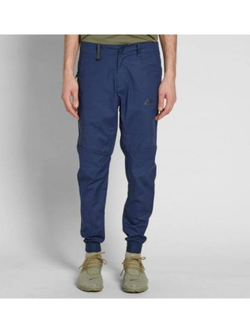 01 823363 451 Bonded Woven Jogger Pants Navy - NIKE - BALAAN 1