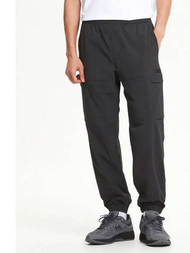 NBNTE31813 UNI ESS Stretch Cargo Jogger Pants DGREY - NEW BALANCE - BALAAN 1