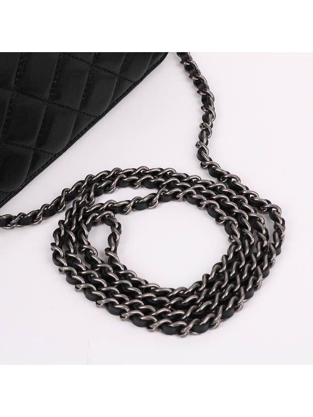 Black calfskin logo WOC cross bag - CHANEL - BALAAN 5