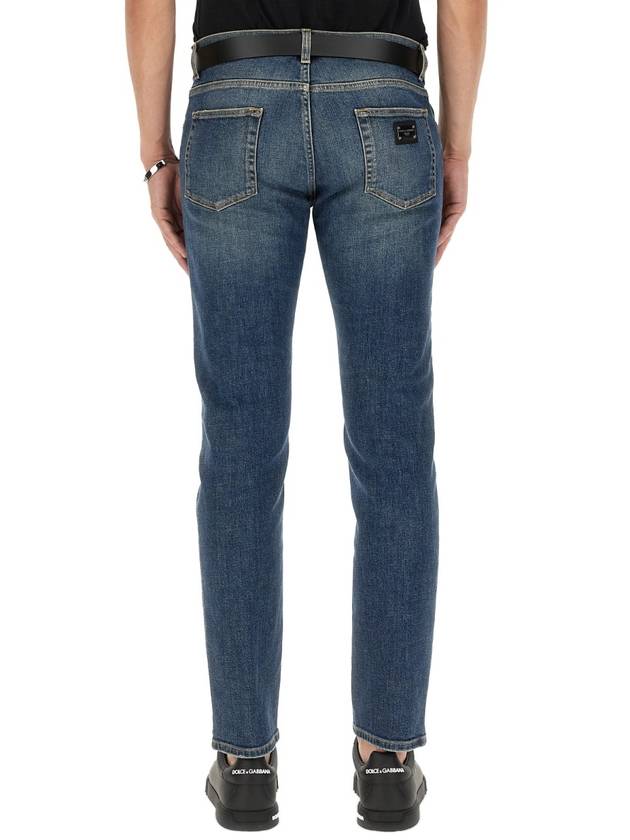 Blue Distressed Slim-Fit Jeans in Cotton Denim Man - DOLCE&GABBANA - BALAAN 12