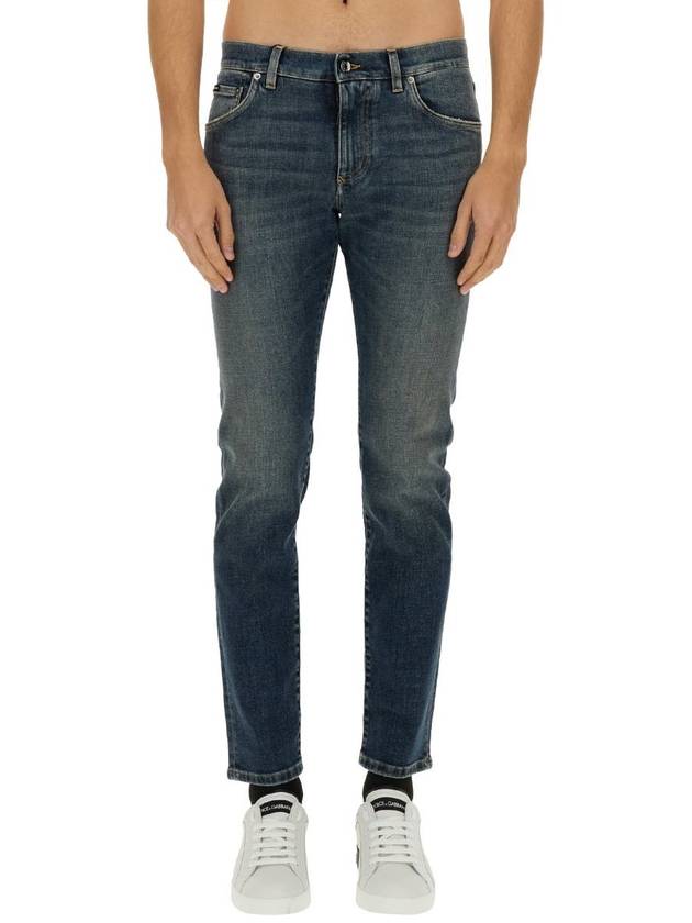 Blue Distressed Slim-Fit Jeans in Cotton Denim Man - DOLCE&GABBANA - BALAAN 2