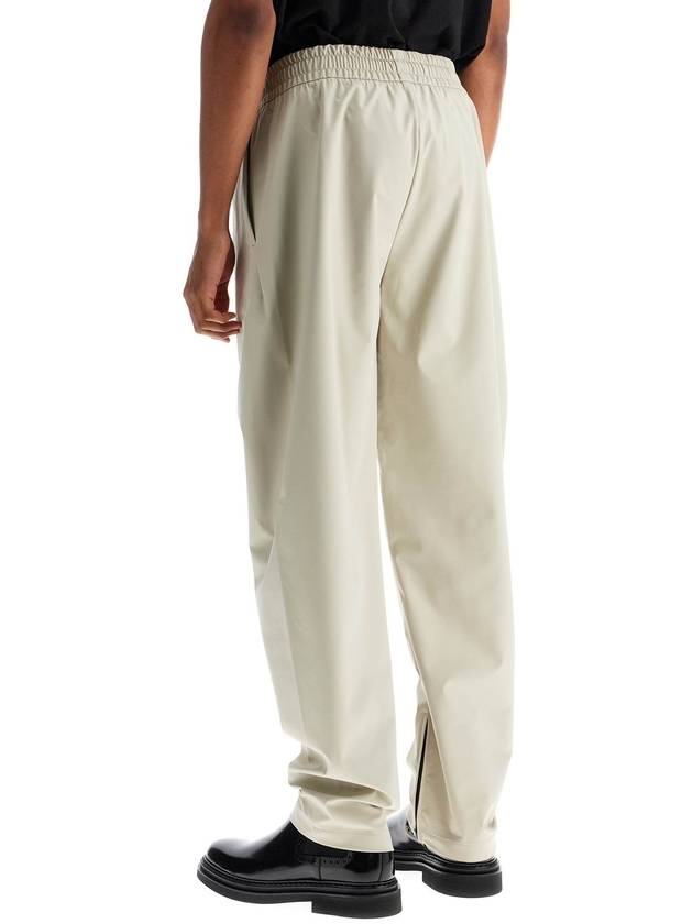 wide leg nylon track pants in cement - FEAR OF GOD - BALAAN 3