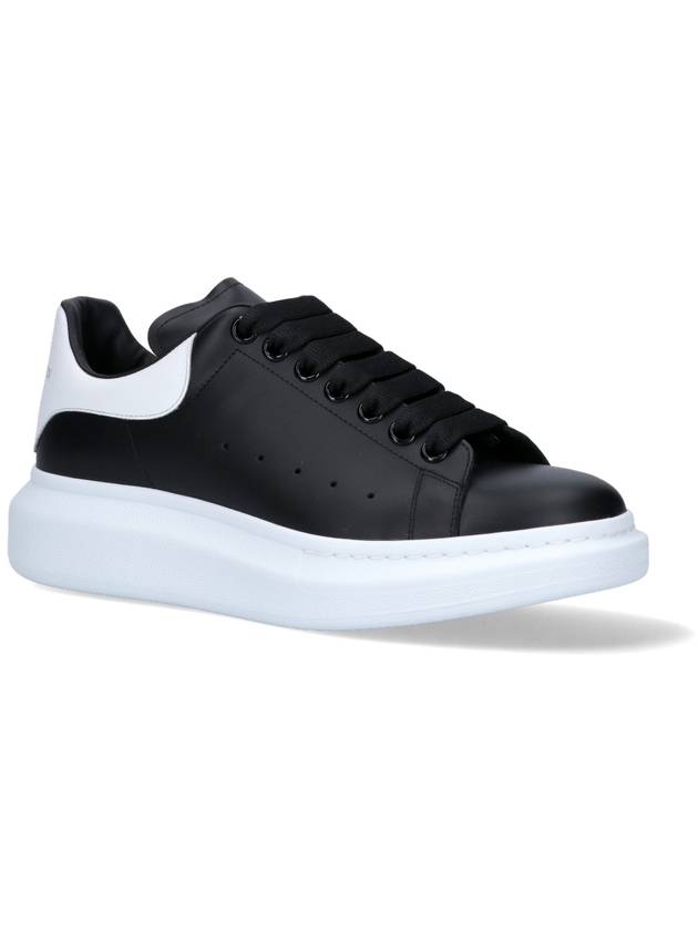 Oversized Leather Tab Low Top Sneakers Black - ALEXANDER MCQUEEN - BALAAN 7