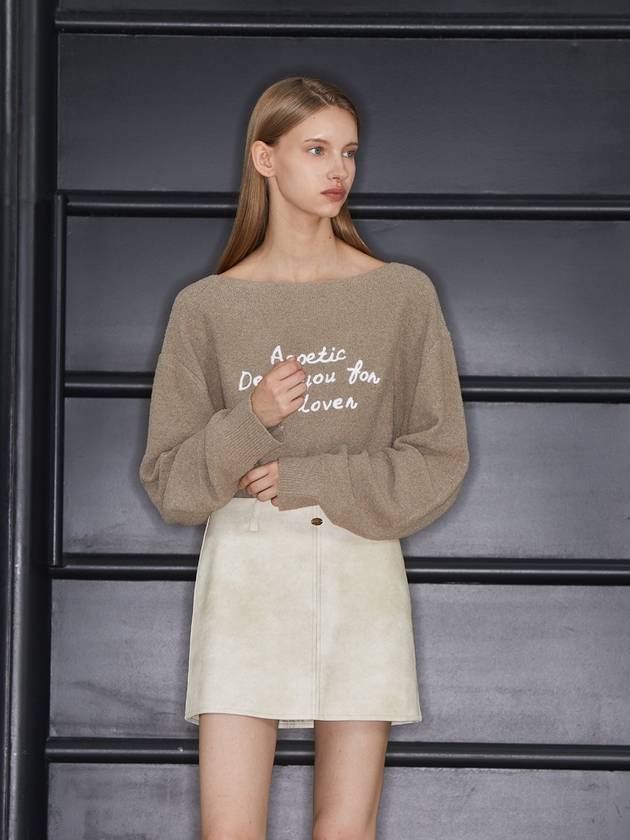 Minnie wearing ANC EMBROIDERY BOATNECK KNIT BROWN - ANOETIC - BALAAN 3