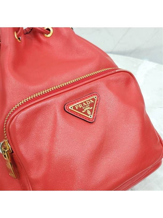 Lux You Red gold triangle logo leather bucket bag - PRADA - BALAAN 5