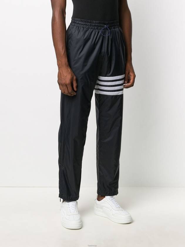 diagonal ripstop track pants navy - THOM BROWNE - BALAAN.