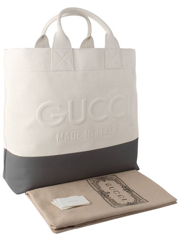 779510 Emboss detail natural canvas luggage shopper bag 33947Y - GUCCI - BALAAN 8