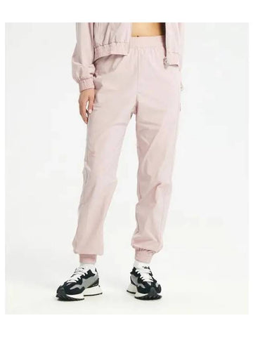 NBNTD3W802 WOMEN Woven Stretch Jogger Pants STANDARD FIT PINK - NEW BALANCE - BALAAN 1